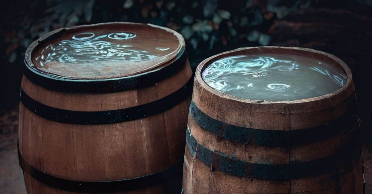 Two wooden barrels of water full to the brim